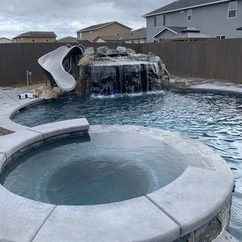 Premier Pools & Spas - Spa, Grotto and Slide during the day - Hot Tub & Pool Near Me - Salida, California