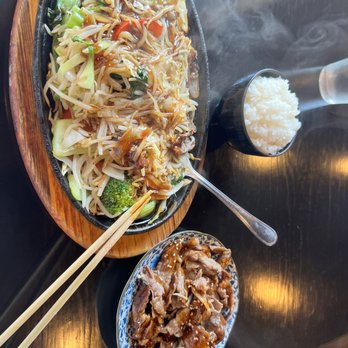 Umami Sushi - a plate of food with chopsticks and rice - Sushi Bars Near Me - Surrey, British Columbia Umami Sushi - a plate of food with chopsticks and rice - Sushi Bars Near Me - Surrey, British Columbia