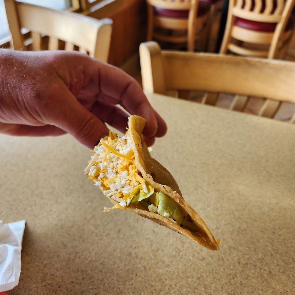 Robertos Mexican Food - a hand holding a taco - Mexican Near Me - Encinitas, California Robertos Mexican Food - a hand holding a taco - Mexican Near Me - Encinitas, California