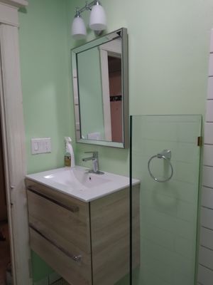 Portland Oregon bathroom remodel. - this is a bathroom remodel done on an condo in the irving street tower in downtown Portland Oregon. customer wanted pertruding electrical fixed, a floating vanity and a roll in file shower floor with penny round tile. Portland Oregon bathroom remodel. - this is a bathroom remodel done on an condo in the irving street tower in downtown Portland Oregon. customer wanted pertruding electrical fixed, a floating vanity and a roll in file shower floor with penny round tile.