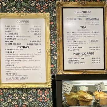 Legacy Coffee - Drink menus - Menu boards displaying coffee, tea, and non-coffee drinks with prices, set against floral wallpaper at a cafe. - Coffee & Tea Near Me - Eau Claire, Wisconsin