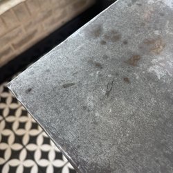 Bodega Wine Market - Metal covered tables that are not very steady. Avoid them!