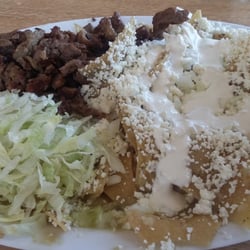 Chilaquiles verde with carne asada. Finger licking good!
