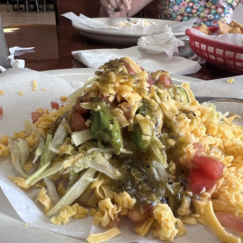 El Jalisco - Bean and cheese chalupa!! I promise there is a tostada underneath this masterpiece. - Mexican Near Me - San Antonio, Texas