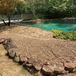 Gilberts Lawn & Handyman - flagstone pavers and river rock design by pool