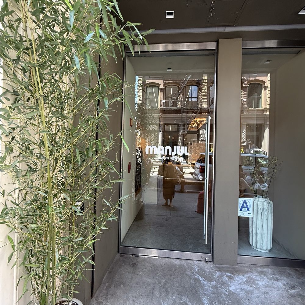 Nice glass door with a big tall green plant Nice glass door with a big tall green plant