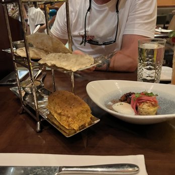 Tiffins Restaurant - Tiffins Signature Bread Service...nice presentation, great taste! And that's my husband lol.. - New American Near Me - Lake Buena Vista, Florida Tiffins Restaurant - Tiffins Signature Bread Service...nice presentation, great taste! And that's my husband lol.. - New American Near Me - Lake Buena Vista, Florida