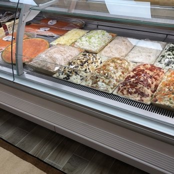 Springfield Hot Bagels - a display case filled with pizzas - Bagels Near Me - Springfield Township, New Jersey