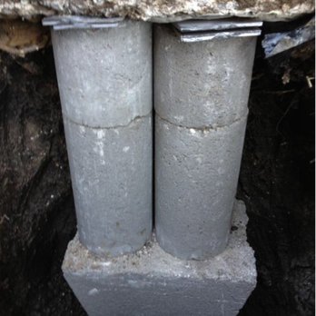 Discount Foundation Repair Specialists - a close up of two concrete pipes - Foundation Repair Near Me - Irving, Texas Discount Foundation Repair Specialists - a close up of two concrete pipes - Foundation Repair Near Me - Irving, Texas