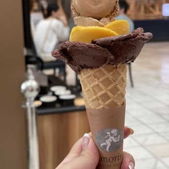 Amorino Gelato - Chocolate,mango, and hazelnut topped with a chocolate macaron - Desserts Near Me - Atlanta, Georgia