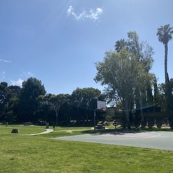 2 basketball courts and 4 picnic tables with grills