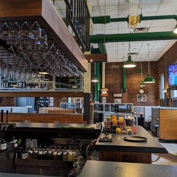 Powerhouse Eatery - a view of a bar with wine glasses hanging from the ceiling - Bars Near Me - White Haven, Pennsylvania Powerhouse Eatery - a view of a bar with wine glasses hanging from the ceiling - Bars Near Me - White Haven, Pennsylvania
