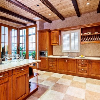 K&P Remodeling - a kitchen with wooden cabinets - Home Organization Near Me K&P Remodeling - a kitchen with wooden cabinets - Home Organization Near Me