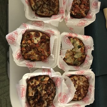 Coconut Kenny's Pizza - Bellingham - a tray of pizzas on a table - Pizza Near Me - Bellingham, Washington Coconut Kenny's Pizza - Bellingham - a tray of pizzas on a table - Pizza Near Me - Bellingham, Washington