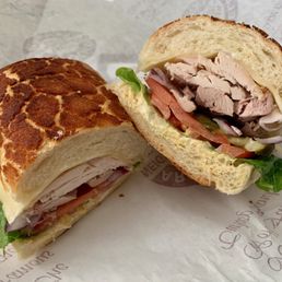 Fresh Roast Turkey Sandwich with Everything (Lettuce, Tomato, Red Onion, Dijon Mustard, Mayo, and Pickles) with Swiss Cheese on Dutch Crunch