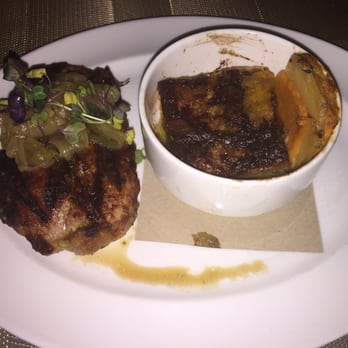 River Stone Chophouse - 2016 Restaurant Week: Pork Ribeye topped w/ caramelized onions and paired w/ yukon gold/sweet potato gratin. Yum! - Steakhouses Near Me - Suffolk, Virginia