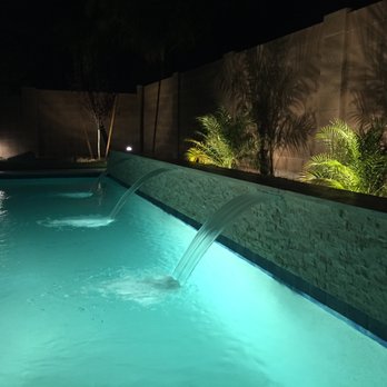 Saturn Pool Company - Waterfalls at night - Pool & Hot Tub Service Near Me