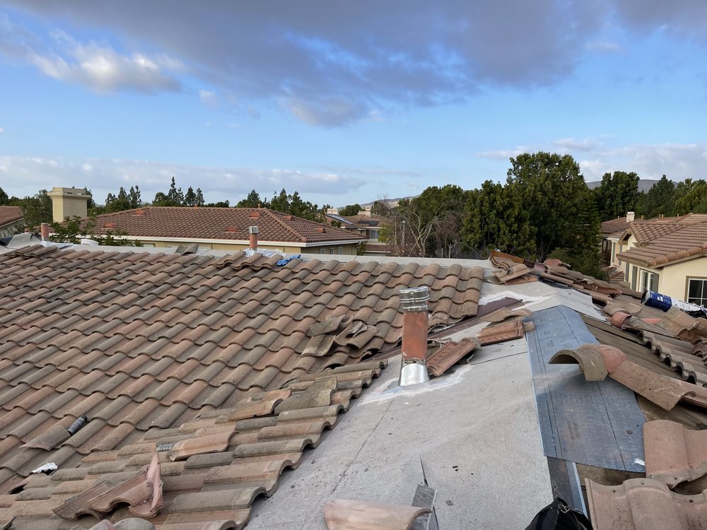 Slide of Rudy’s roofing