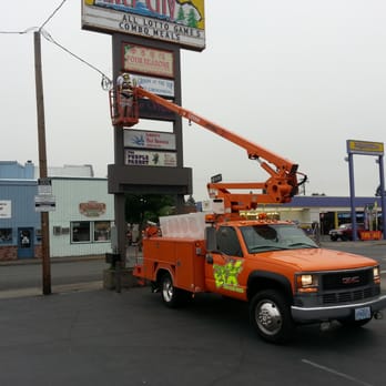 Visual Signs & Graphics - Hanging a Sign on 6th street in Grants pass. - Graphic Design Near Me - Grants Pass, Oregon Visual Signs & Graphics - Hanging a Sign on 6th street in Grants pass. - Graphic Design Near Me - Grants Pass, Oregon