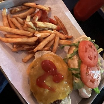 Double Ts Tavern - Classic burger with fries - A tray holds a cheeseburger with ketchup, a side of French fries, and a small salad with tomato slices and lettuce. - Bars Near Me - Marlborough, Massachusetts