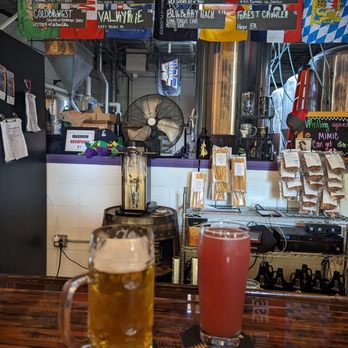 Miskatonic Brewing - two mugs of beer on a bar - Breweries Near Me - Darien, Illinois