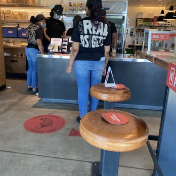 Chipotle Mexican Grill - "employees" huddled around the POS system, apparently one person isn't enough - Mexican Near Me - Randolph, Massachusetts