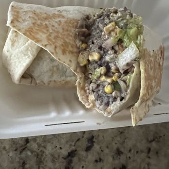 Masa Masa - Veggie Burrito in half - Tacos Near Me - Roseville, California Masa Masa - Veggie Burrito in half - Tacos Near Me - Roseville, California
