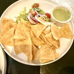 Corn chips, guacamole and salsa