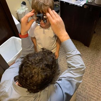 Trade Winds Dental - Dad Fits His Son With Loupes - Trade Winds Dental - Periodontists Near Me - Georgetown, Texas Trade Winds Dental - Dad Fits His Son With Loupes - Trade Winds Dental - Periodontists Near Me - Georgetown, Texas