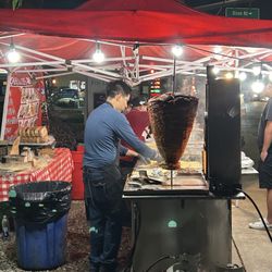 Taqueria Los Perrones - Another shot of the Al Pastor with the grill man working