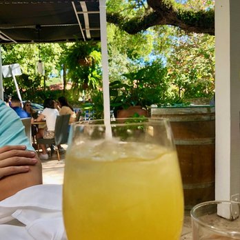 Ariete - White sangria (with rum!) and view of outdoor patio area. - New American Near Me - Miami, Florida