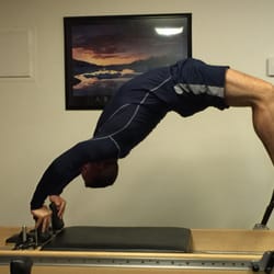 Bodywise - Wheel pose on Reformer