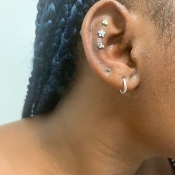 Energy Tattoo - Changed to high quality jewelry some weeks later. Bump pushing on bottom. - Tattoo Near Me - Santa Barbara, California Energy Tattoo - Changed to high quality jewelry some weeks later. Bump pushing on bottom. - Tattoo Near Me - Santa Barbara, California