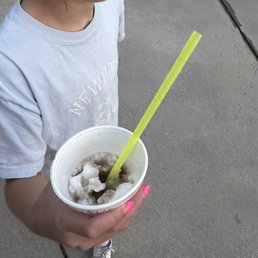 a little girl holding a cup of ice cream a little girl holding a cup of ice cream