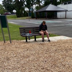 Garden Home Recreation Center - This is the preschool age group's summer camp counselor. Hard at work, texting.