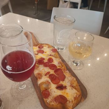 Ballast Point - Pepperoni pizza flatbread with Moon Berry Cider and glass of Pinot Gris. - Brewpubs Near Me - Anaheim, California
