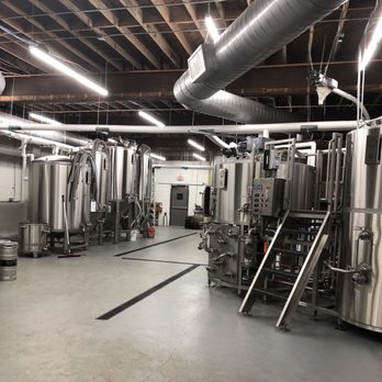Slow Pour Brewing Company - You can even walk to the back and see the brewing containers. - Breweries Near Me - Lawrenceville, Georgia