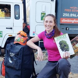 Climbing Fox Tree Service - Climbing Fox Tree Service ISA Certified Arborist Sarah with one of her favorite Arboriculture books 'The Sibley Guide to trees'