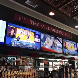 The Village Pub - Full bar and elegant ceiling