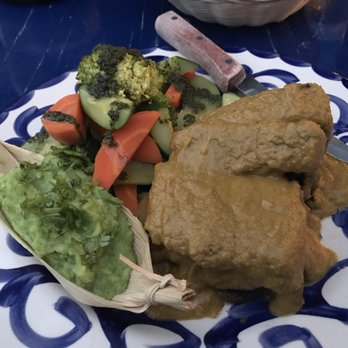 Mi Casa - Mole with nasturtiums and zucchini's flower over short ribs - Mexican Near Me - San José del Cabo, BCS Mi Casa - Mole with nasturtiums and zucchini's flower over short ribs - Mexican Near Me - San José del Cabo, BCS