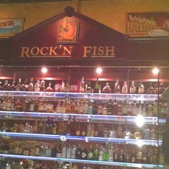 Rock'N Fish - Man on the liquor ladder in Rock n Fish. - Seafood Near Me - Manhattan Beach, California Rock'N Fish - Man on the liquor ladder in Rock n Fish. - Seafood Near Me - Manhattan Beach, California