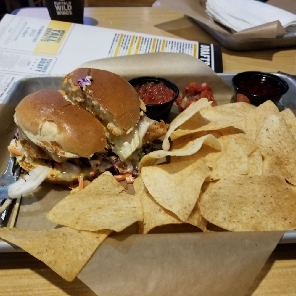 Buffalo Wild Wings - Southern Chicken Sandwich cut in half with chips and salsa. - Chicken Wings Near Me - Fort Worth, Texas Buffalo Wild Wings - Southern Chicken Sandwich cut in half with chips and salsa. - Chicken Wings Near Me - Fort Worth, Texas
