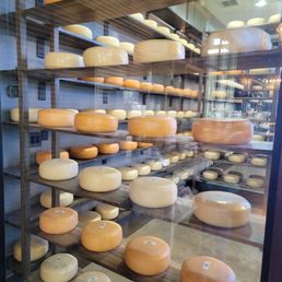 Wheels of cheese aging. Wheels of cheese aging.