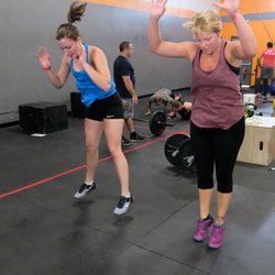 NC Fit Iron Strong - Family is extremely important at Iron CrossFit . Many members have their daughters there with them .