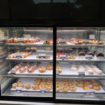 Paris Baguette - Pastry case with donuts and croissants. - Coffee & Tea Near Me - Reston, Virginia Paris Baguette - Pastry case with donuts and croissants. - Coffee & Tea Near Me - Reston, Virginia