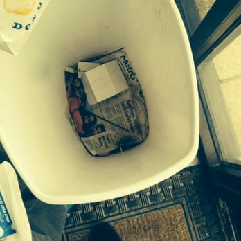 Hot Donuts - Trash can with 7 month old newspaper liner. Even my 8 year old asked if we really were supposed to throw garbage right in there. - Donuts Near Me - Rowlett, Texas