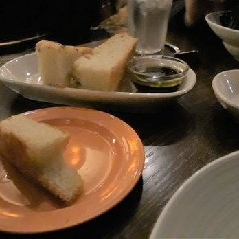 Tulio - Foccacia is without flavor. It is served with Olive Oil for dipping. You may request Balsamic Vinegar. - Italian Near Me - Seattle, Washington Tulio - Foccacia is without flavor. It is served with Olive Oil for dipping. You may request Balsamic Vinegar. - Italian Near Me - Seattle, Washington