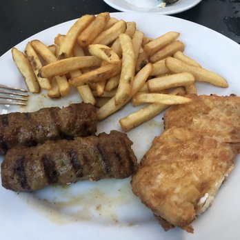Villa Romana - This is not one dish, this is half a mititei (comes with 4) and half a chicken schnitzel, we split two dishes - Italian Near Me - Hollywood, Florida Villa Romana - This is not one dish, this is half a mititei (comes with 4) and half a chicken schnitzel, we split two dishes - Italian Near Me - Hollywood, Florida