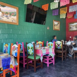 tables and chairs in a mexican restaurant tables and chairs in a mexican restaurant
