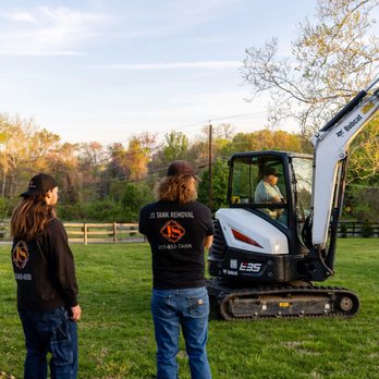JS Tank Removal - two men standing in front of a tractor - General Contractors Near Me - Upper Marlboro, Maryland JS Tank Removal - two men standing in front of a tractor - General Contractors Near Me - Upper Marlboro, Maryland